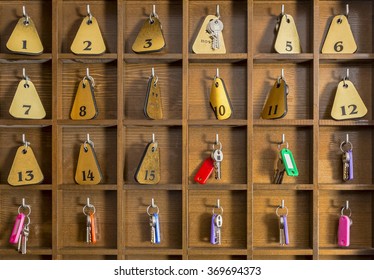 Rooms keys at a two stars hostel reception desk counter.