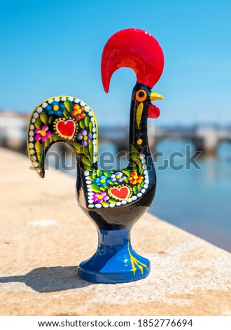 Rooster of Barcelos (Galo de Barcelos) on a quay of Gilao River. Tavira, Algarve, Portugal
