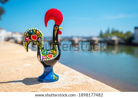 Rooster of Barcelos (Galo de Barcelos) on a coast of river Gilao. Tavira, Algarve, Portugal
