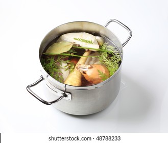 Root vegetables in a stew pot - Powered by Shutterstock