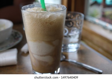 Rootbeer Float With A Green Straw