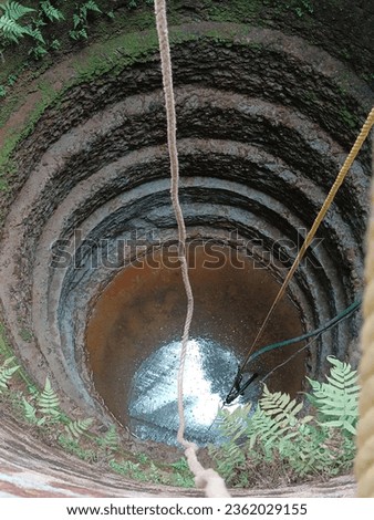 A rop dipped in a well
