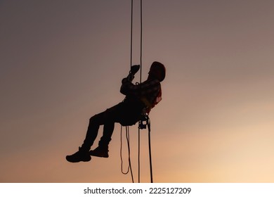 rope access, foreman operation control training the abseiling from the height silhouette 