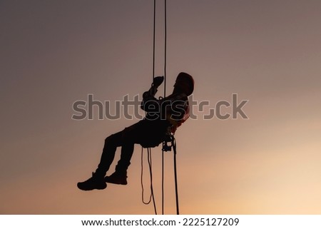 rope access, foreman operation control training the abseiling from the height silhouette 