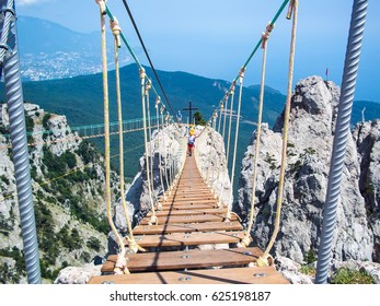 The rope bridge between the peaks of Mount Ai-Petri - Shutterstock ID 625198187