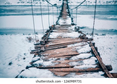 Rope Bridge Broken And Covered By Snow 