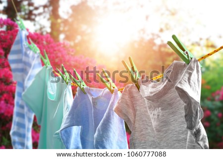 Rope with clean clothes outdoors on laundry day