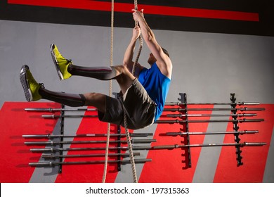 Rope Climb Exercise Man Workout At Gym Climbing