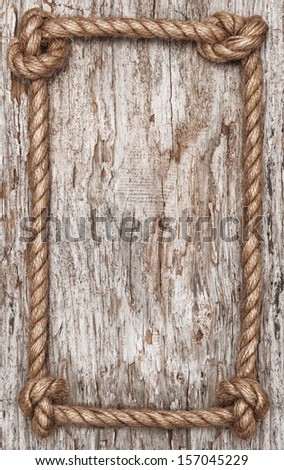 Rope frame and old wood background