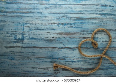 Rope Heart On A Wooden Background