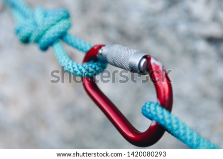 Rope Knot with red carabiner for the active sports
