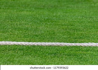 Rope Marking The Boundary Of A Rural Village Cricket Pitch