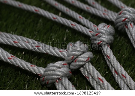 Rope net on the green grass.