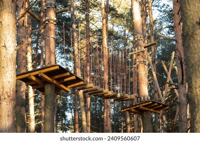 Rope obstacle track high in the trees in adventure park. - Powered by Shutterstock