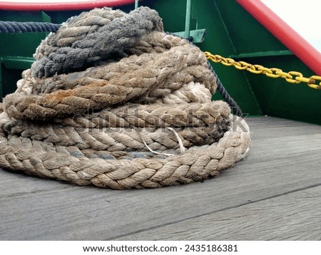 The rope on the ship is used to moor the ship when it docks at the port. Located on the floor of the tugboat deck.