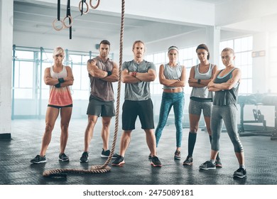 Rope, portrait and group of athletes in gym for health, wellness and body workout challenge. Fitness class, friends and team of people with personal trainer for exercise together in sports center. - Powered by Shutterstock