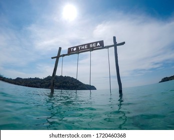 Rope Swing In Tropical Crystal Clear Water Reading 