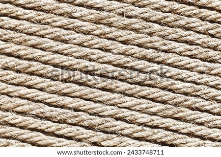 Rope texture. Brown old rope lines. Striped pattern. Retro textile texture. Stripes background on canvas. Twine pattern.