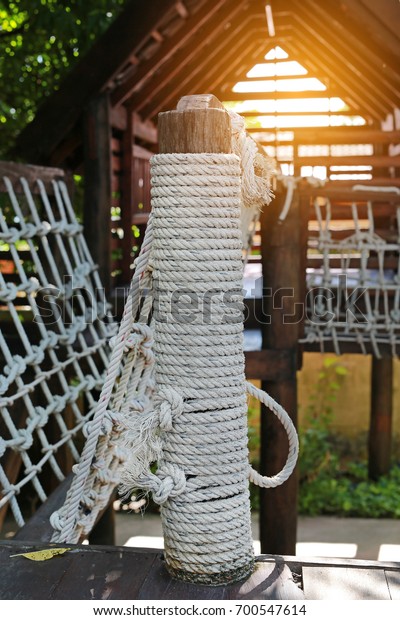 Rope and walk bridge with side rope protection\
on handrails