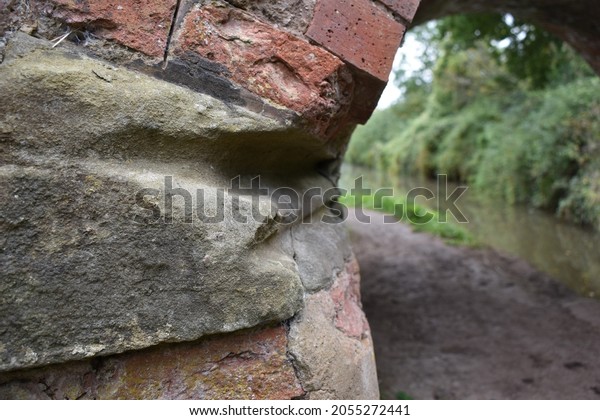 Rope worn grooves cut\
into the sandstone of a bridge on the Stratford upon Avon to\
Birmingham canal. 