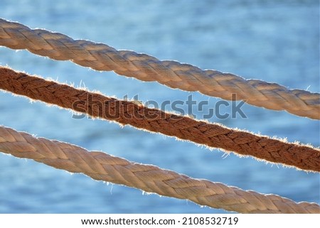 Ropes for the boats with sea background
