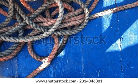 ropes on a wooden background. Rope on the ship
