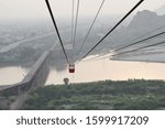 in a ropeway cable car going down from genting highlands to chiniot pakistan 