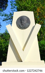 ROQUEBRUNE-CAP-MARTIN, FRANCE -22 APR 2018- View Of A Liberty Road V Marker With A Plaque Commemorating Sir Winston Churchill In  Roquebrune-Cap-Martin On The French Riviera.