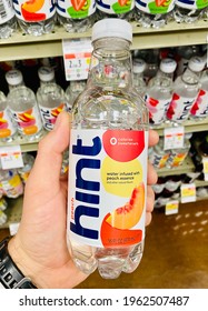 Ros, CA - April 25, 2021: Hand Holding A Bottle Of Hint Water Inside A Supermarket. 