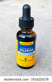 Ros, CA - February 13, 2021: Valerian herb drops by Herb Pharm on concrete closeup. 