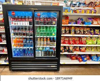 Ros, CA - January 17, 2021: Soft Drinks And Chips Junk Food Shelf Near A Check Out Register Inside A Big Box Store.