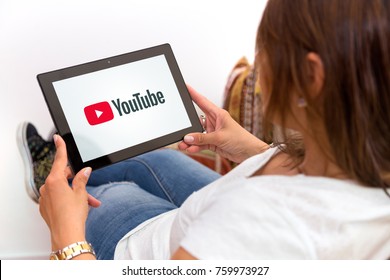 ROSARIO, ARGENTINA - OCTOBER 28, 2017: Girl At Home Watching A Tablet With Youtube On The Screen. Young Woman Resting In Her Sofa. Millennial. Communications. Video Streaming.