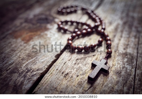 Rosary beads and religious crucifix cross with\
copy space background