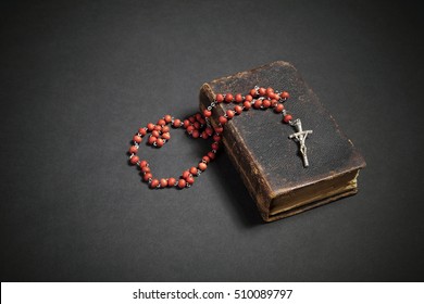 Rosary On The Old Bible 