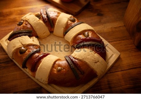Rosca de Reyes, also called Three Kings Bread, Roscon, Epiphany Cake, traditionally served with hot chocolate in a clay Jarrito. Mexican tradition on January 5th.