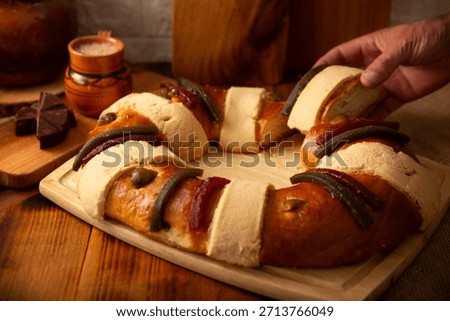 Rosca de Reyes, also called Three Kings Bread, Roscon, Epiphany Cake, traditionally served with hot chocolate in a clay Jarrito. Mexican tradition on January 5th.