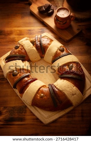 Rosca de Reyes, also called Three Kings Bread, Roscon, Epiphany Cake, traditionally served with hot chocolate in a clay Jarrito. Mexican tradition on January 5th.