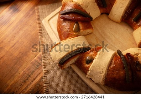 Rosca de Reyes, also called Three Kings Bread, Roscon, Epiphany Cake, traditionally served with hot chocolate in a clay Jarrito. Mexican tradition on January 5th.