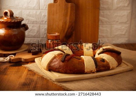 Rosca de Reyes, also called Three Kings Bread, Roscon, Epiphany Cake, traditionally served with hot chocolate in a clay Jarrito. Mexican tradition on January 5th.