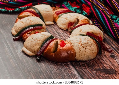Rosca de reyes or Epiphany cake for kings day on wooden table in Mexico Latin America