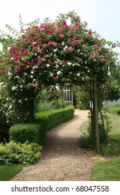 Rose Arch In English Country Garden