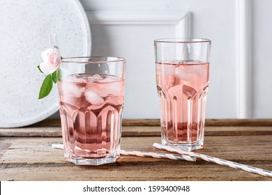 Rose Cocktail In A Glass With Ice. Pink Lemonade, Tonic.