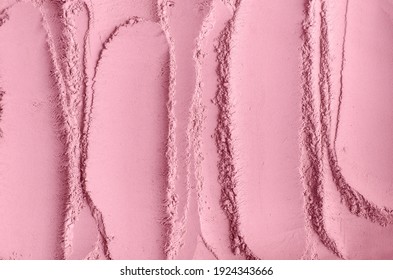 Rose cosmetic clay powder (alginate facial mask, body wrap, make-up blusher) texture close up, selective focus. Abstract pink background with brush strokes. 