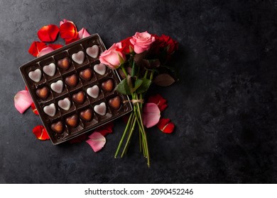 Rose Flowers And Heart Shape Chocolate. Valentines Day Greeting Card With Space For Your Greetings. Top View Flat Lay