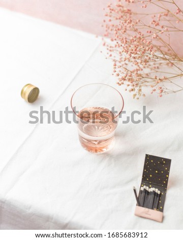 Rose Glass Styled on Table Top with Pink Baby's Breath