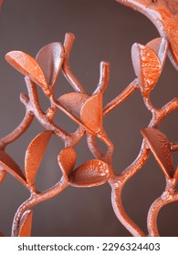 rose gold painted wrought iron artwork