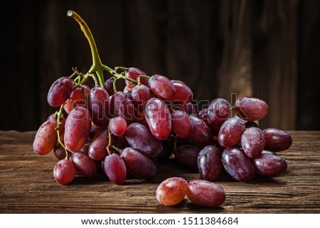 rose grape bunch on vintage wooden background
