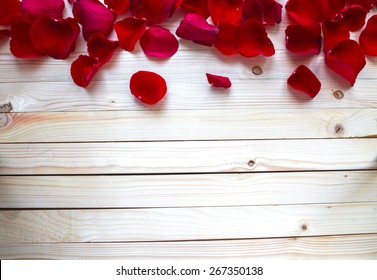 Rose Petals Border On A Wooden Table