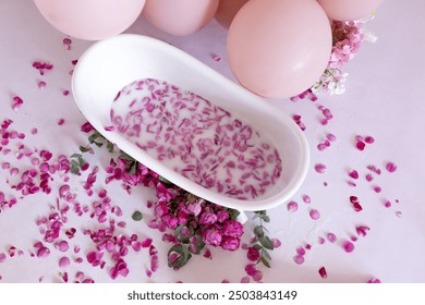 Rose petals put in bathtub for romantic bathroom in honeymoon suit.Arranged by interior designer for honeymoon couple. Scent of rose make relax. Spa shop put flowers in the tub with towels for lover. - Powered by Shutterstock