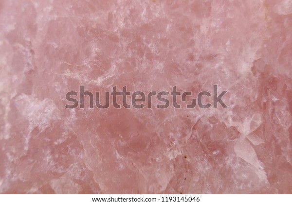 Rose quartz background. Closeup of\
pink rose quartz  surface.quartz gemstone pink\
macro